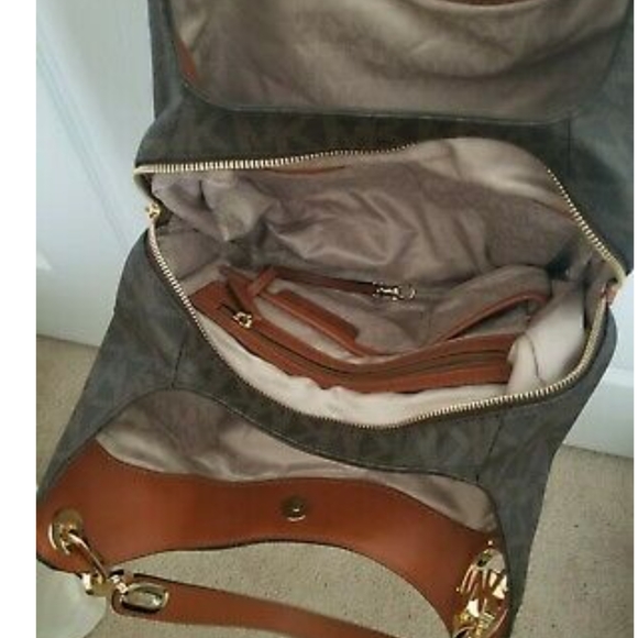 Authentic Michael Kors Fulton Brown Signature Leather. used in good condition - Picture 5 of 11
